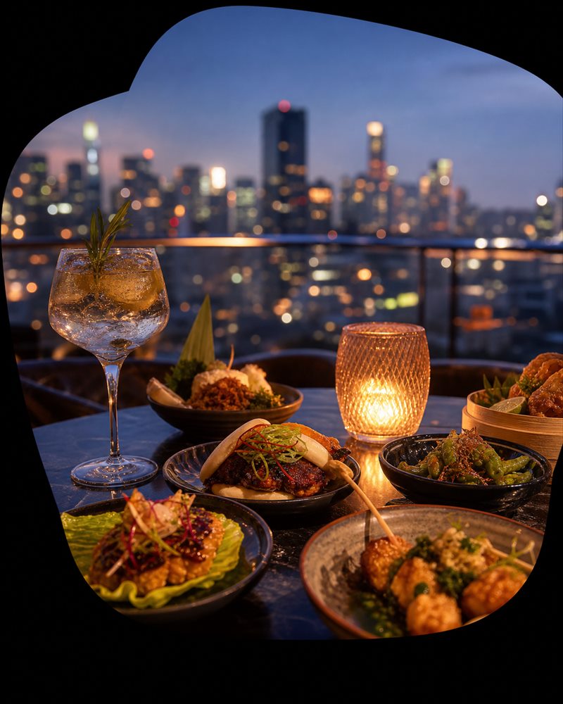 Small plates on a city rooftop at dusk